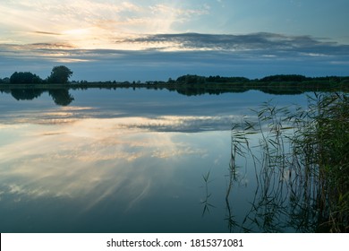 The reflection of the sky in a calm lake
