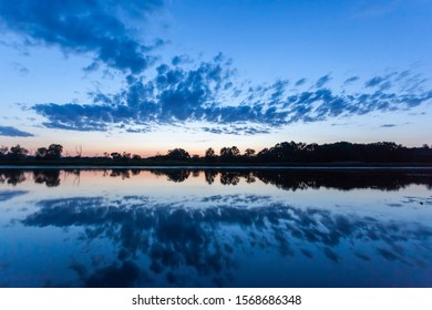 reflection of the sky in the river at sunset