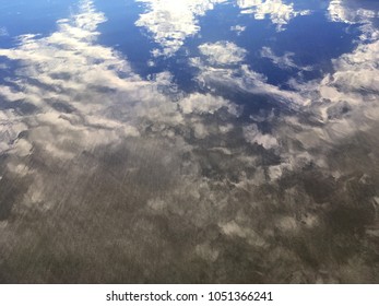 reflection of the sky in the surf