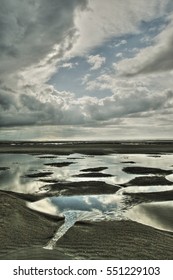 Reflection of the sky in the water, Le Touquet beach in France