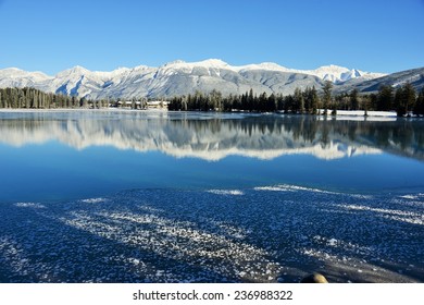 Reflection of Snow-Capped Mountains in Lake Beauvert,  