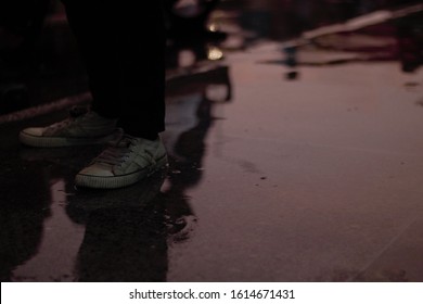 the reflection of someone shoe