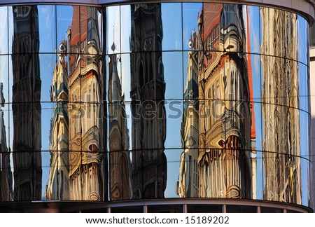 Reflection of St. Stephen's Cathedral in the new building of Haas Haus Vienna, Austria