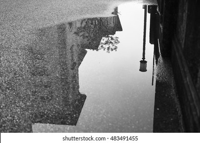  Reflection Street Lamp In A Puddle On The Alley Old City.