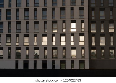 Reflection of sun in windows of building.