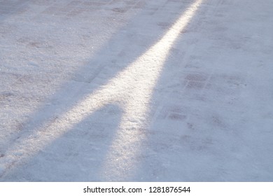 The reflection of sunlight on a snowy surface. Sunbeam on the snow surface. Winter frosty sunny day.