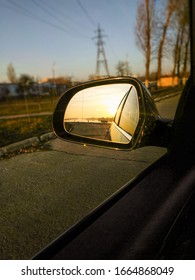 Reflection Of A Sunny Road In The Rearview Mirror