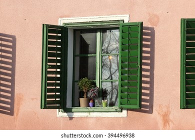 The reflection of the sunshine in an old window.