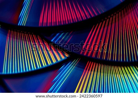Reflection of the surface of a DVD discs with artistic lighting close-up