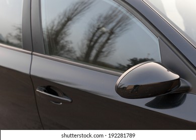 Reflection Of Trees In The Window Of A Car