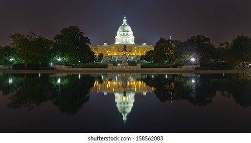 Reflection Of US Capitol Building At Night