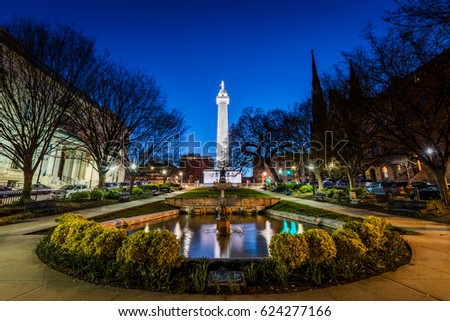 Reflection of the washington Monument from the pond in Mount Vernon Baltimore, Maryland at night
