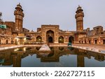 Reflection of Wazir Khan mosque in a pond present in its courtyard Lahore, Pakistan