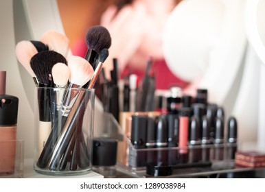 Reflection of young beautiful woman applying her make-up, looking in a mirror. - Shutterstock ID 1289038984