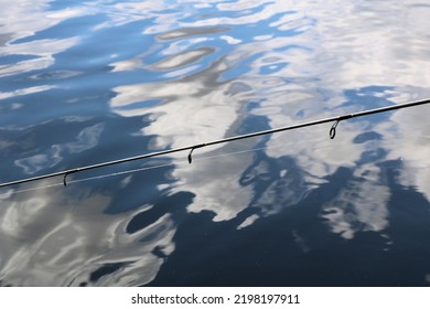 Reflections Of The Blue Sky And White Clouds In The Clear Lake Water