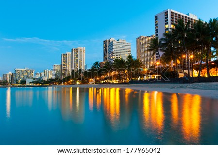 Reflections of buildings at Waikiki in the water.