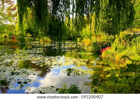 Reflections of clouds and sky in the water lily pond of Claude Monet's garden of Giverny, France