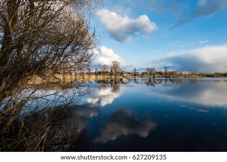 Similar – Image, Stock Photo sun-yellow houses are reflected in a stream…