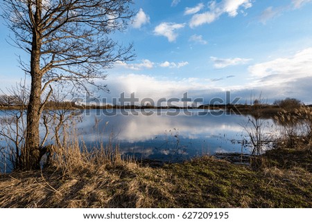 Similar – Image, Stock Photo sun-yellow houses are reflected in a stream…