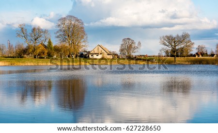 Similar – Image, Stock Photo sun-yellow houses are reflected in a stream…