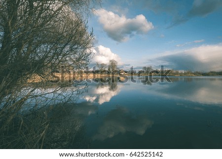 Similar – Image, Stock Photo sun-yellow houses are reflected in a stream…