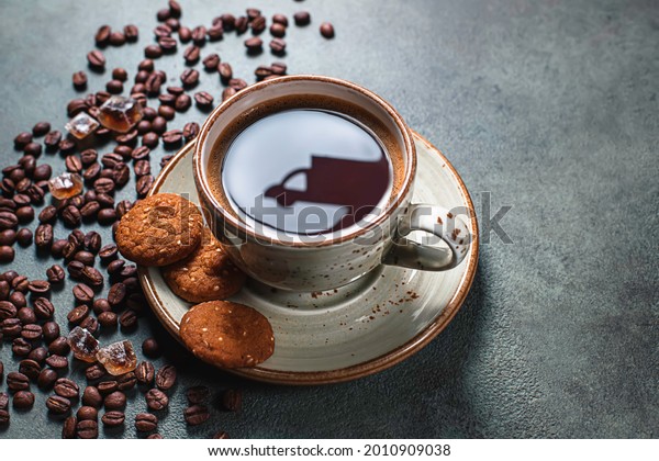 Reflections of a delivery\
car on a cup of coffee. Online shopping. Concept of delivery\
services, logistics, cargo delivery. Food delivery background\
concept. Copy space