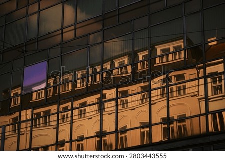 Reflections in glassy surface of office building - Karlin
