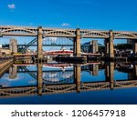 reflections of high level, swing and tyne bridges in Newcastle upon tyne, England