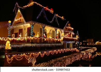 Reflections Of House With Christmas Lights In Venice California