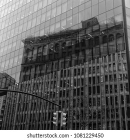 Reflections Of An Old Building On A New Building. IBM Building In Astor Place Nyc.