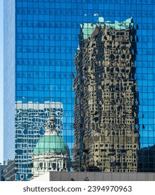Reflections of Old Courthouse and modern office skyscraper in a mirrored building in downtown St Louis in Missouri - Shutterstock ID 2394970963