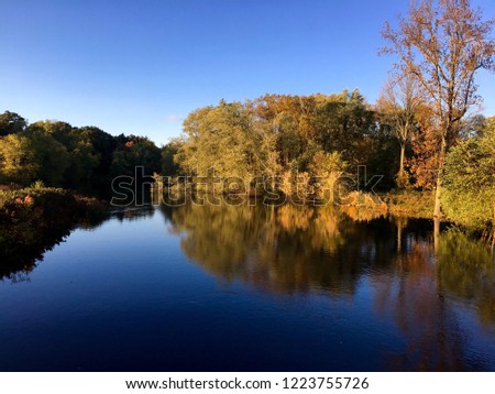 Reflections on the Concord River at the Minute Man National Historical Park in Massachusetts. New England, USA.