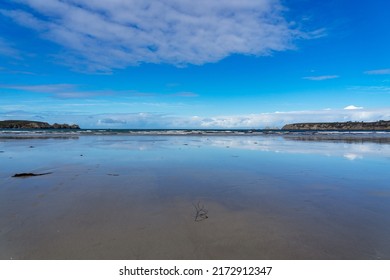 Reflections on a sandy beach at low tide on a beautiful sunny day in Brittany - Shutterstock ID 2172912347