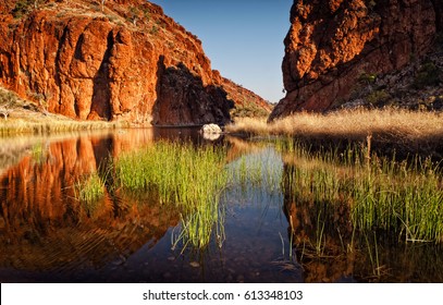 Reflections Of Rock Formations At Glen Helen Gorge Water Hole In Northern Territory Central Australia