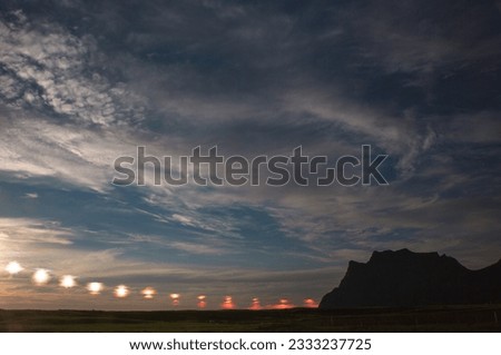 Reflections; Selfjorden, Fredvang in a misty parenthesis; Cloud and sea striations; Moskenesøya, Midnight sun timelapse; Utakleiv beach, Vestvågøya, Lofoten Islands, Arctic Norway