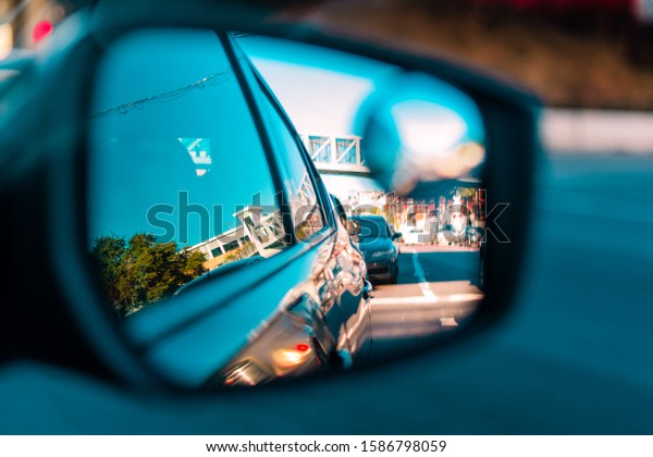 Reflections of the street\
from the mirror.