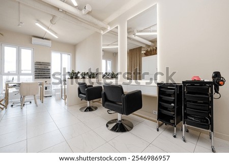Similar – Image, Stock Photo In the hair salon, a moody enchantress, dressed in chic business attire, radiated beauty is thinking about things. A gorgeous girl might be waiting for a client. A true professional makeup artist alone in her thoughts.