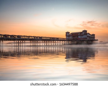 Reflections of sunrise at the pier