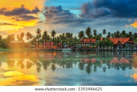 Reflections of Thai houses near Mae Klong River at sunset, Amphawa
Samut Songkhram Province, Thailand