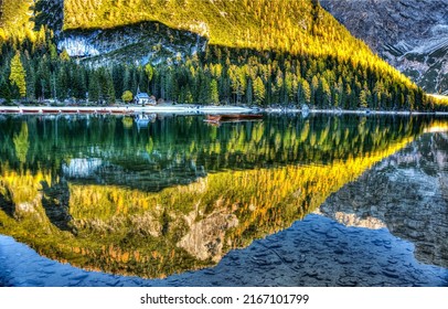Reflections in the water of a mountain lake in autumn. Autumn mountain lake water reflection. Beautiful lake water reflection. Autumn lake water in mountains - Shutterstock ID 2167101799