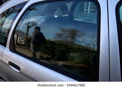 Reflections in the window of a car