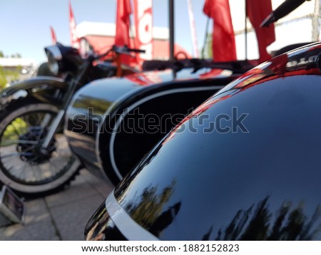 reflections from the wing of an old motorcycle