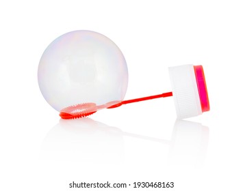 Reflective Bubble Stuck On A Children's Bubble Wand Toy Isolated On White Background With Shadow Reflection - Clipping, Vector Path. Big Soap Bubble Hanging On Bubble Blower Isolated Over White.