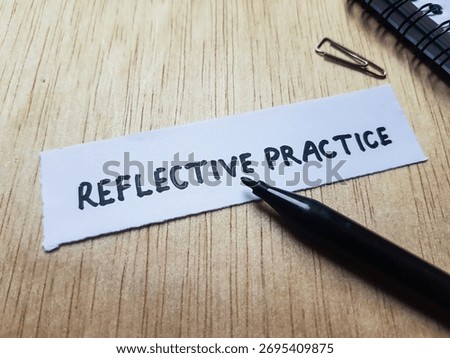 Reflective practice writting on table background.