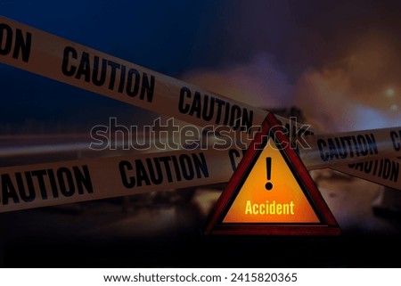Reflective red triangle and caution ribbon to point out accident in night background 