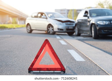 Reflective red triangle to point out a car crash  - Shutterstock ID 712608241