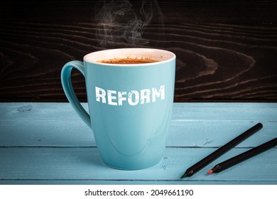 Reform. Health, Education And Business Concept. Coffee Mug On The Table.