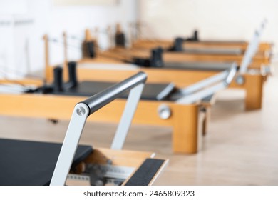 Reformer pilates studio machine for fitness workouts in gym - Powered by Shutterstock