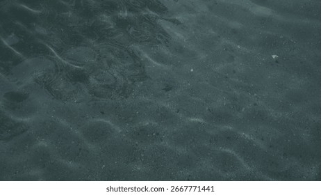 Refraction of light from the sun into a pool of clear spring water