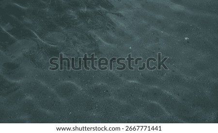 Refraction of light from the sun into a pool of clear spring water